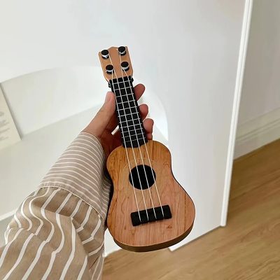 Vista detallada de Mini Guitarra Ukulele para Niños - Ukulele Clásico de Madera Natural
